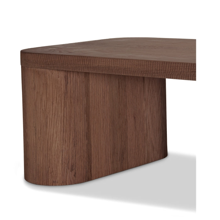 Table basse minimaliste en bois massif avec base monolithique pour salon